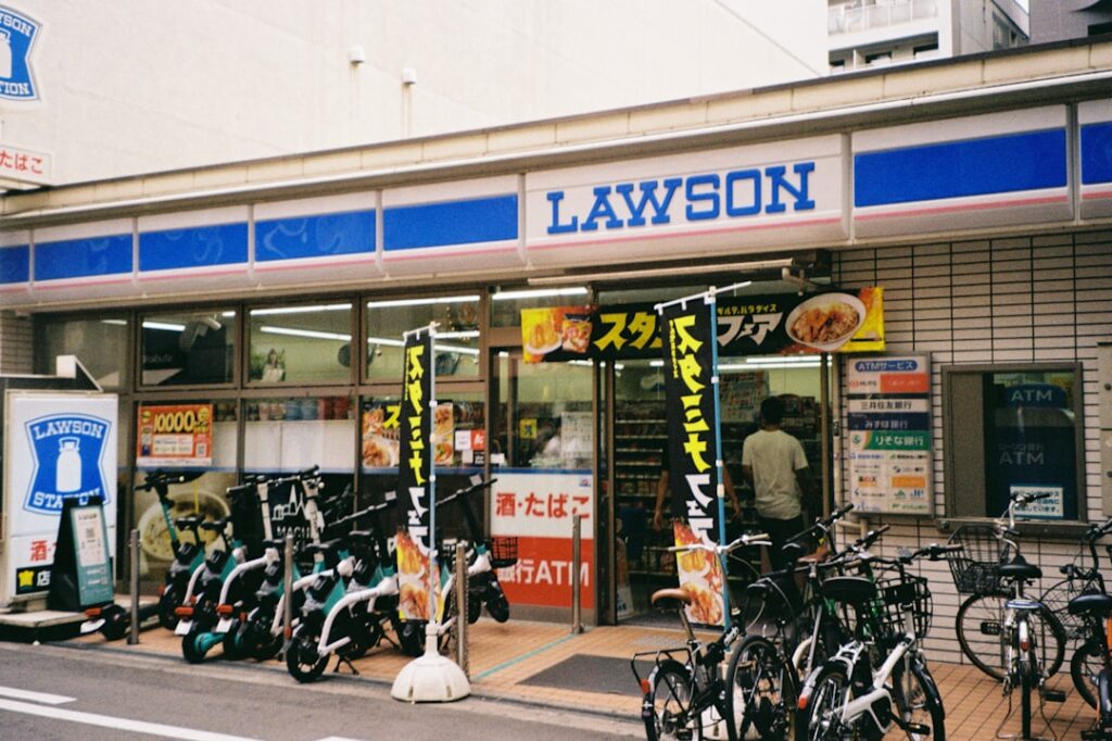 Lawson convenience store with parked bikes and scooters