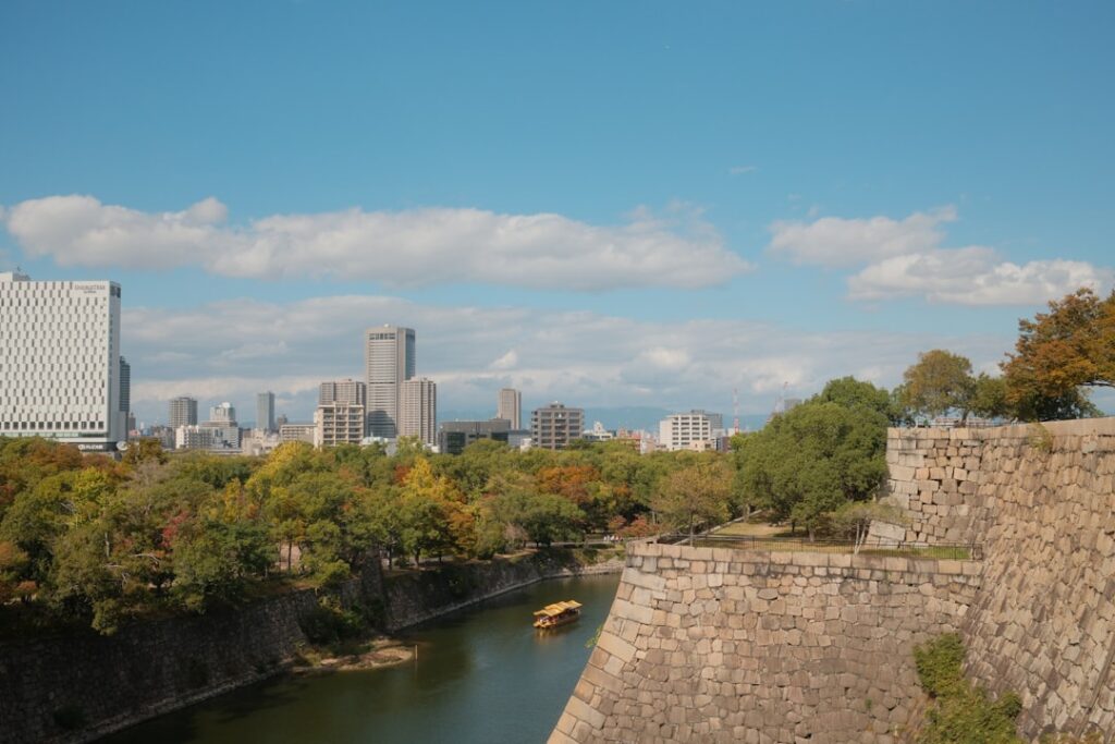 Castle walls with a canal and city skyline
