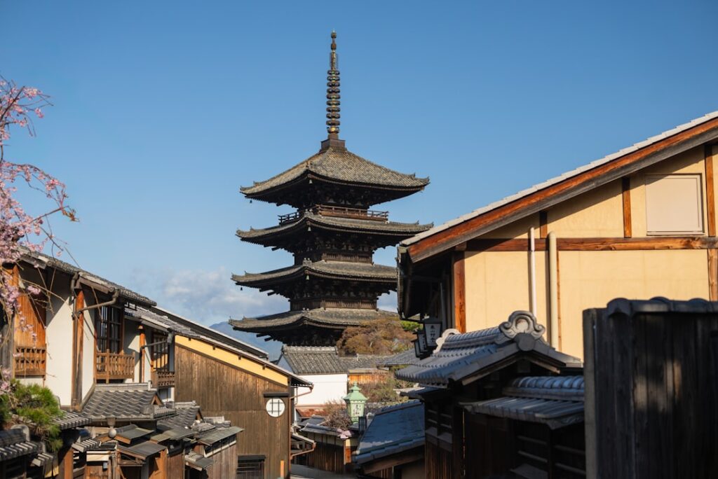Historic pagoda towers over traditional japanese buildings
