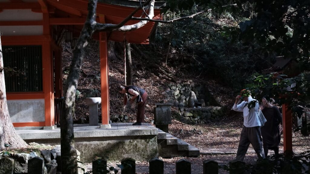 People at a japanese shrine entrance