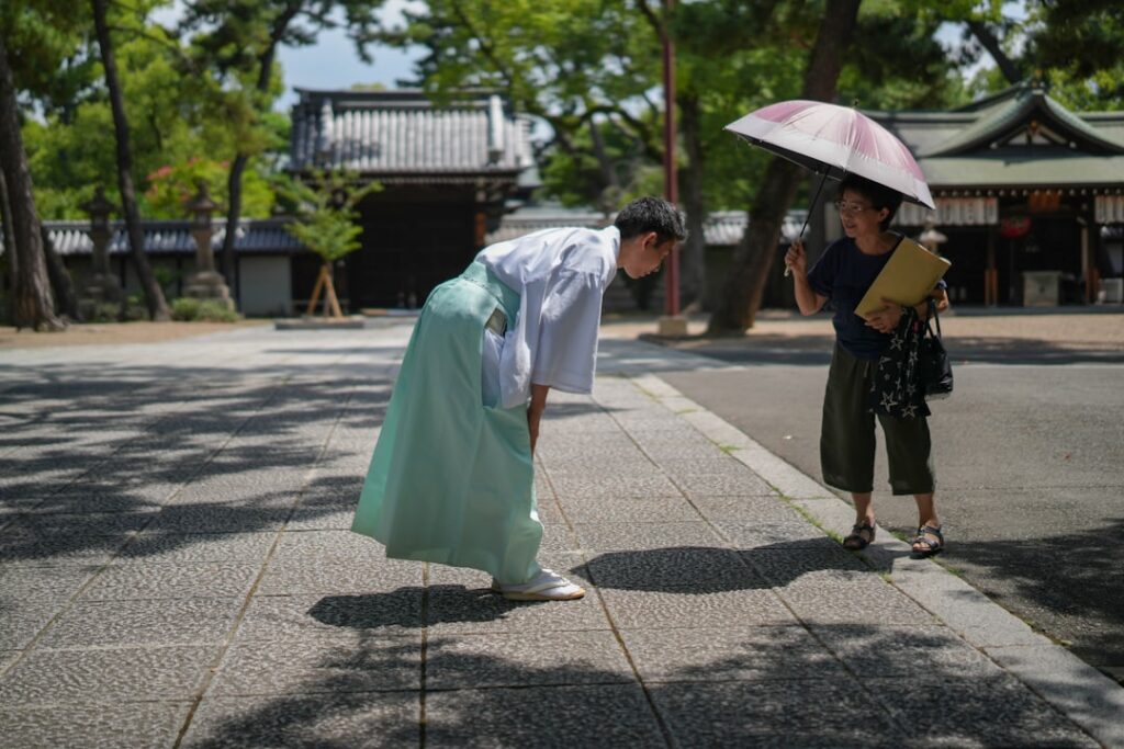 A woman in a kimono holding an umbrella